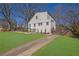 Backyard view featuring a long driveway and beautiful lawn at 1630 Sylvan Sw Rd, Atlanta, GA 30310