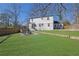 A spacious backyard with a stone patio and a seating area perfect for outdoor entertaining at 1630 Sylvan Sw Rd, Atlanta, GA 30310
