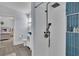 Modern bathroom with a rainfall shower and stylish blue tiled niche at 1630 Sylvan Sw Rd, Atlanta, GA 30310