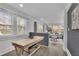 Living Room featuring hardwood floors, brick accents, and lots of natural light at 1630 Sylvan Sw Rd, Atlanta, GA 30310
