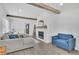 Cozy living room with a modern fireplace, wood beams, and comfortable seating at 1630 Sylvan Sw Rd, Atlanta, GA 30310