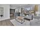 Comfortable living room featuring hardwood floors, brick accents, and lots of natural light at 1630 Sylvan Sw Rd, Atlanta, GA 30310