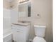 Bathroom featuring a shower-tub combination and a vanity with a granite countertop, plus a classic white toilet at 542 Oak Hills Sw Rd, Mableton, GA 30126