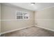 Bedroom featuring carpet and neutral paint with a window and white trim at 542 Oak Hills Sw Rd, Mableton, GA 30126