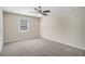 Bedroom with neutral walls, carpeted floor, ceiling fan and a window for natural light at 542 Oak Hills Sw Rd, Mableton, GA 30126