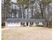 Charming single-story home with an attached two-car garage and a well-maintained front yard at 566 Sugar Valley Lane, Conyers, GA 30094