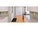 A kitchen featuring white cabinets, stainless steel appliances, and hardwood floors at 566 Sugar Valley Lane, Conyers, GA 30094