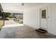 View of a carport featuring concrete flooring, white trim, and a view of the driveway and front yard at 405 Dan Se Pl, Smyrna, GA 30082