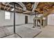 Unfinished basement with exposed ceiling, painted brick walls, window, and utility connections at 571 Tahoe Cir, Stone Mountain, GA 30083