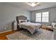 Bright bedroom with hardwood floors, a plush rug, and a comfortable full-sized bed at 571 Tahoe Cir, Stone Mountain, GA 30083