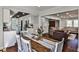 Open-concept living space with hardwood floors, neutral decor, and plenty of natural light at 571 Tahoe Cir, Stone Mountain, GA 30083
