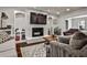 Bright living room with a brick fireplace and bookshelves at 571 Tahoe Cir, Stone Mountain, GA 30083