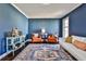Cozy living room featuring hardwood floors, and blue painted walls at 571 Tahoe Cir, Stone Mountain, GA 30083