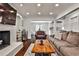 Bright living room with a brick fireplace and bookshelves at 571 Tahoe Cir, Stone Mountain, GA 30083