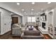 Bright living room with a brick fireplace and bookshelves at 571 Tahoe Cir, Stone Mountain, GA 30083