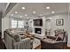 Bright living room with a brick fireplace and bookshelves at 571 Tahoe Cir, Stone Mountain, GA 30083