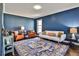 Cozy living room featuring hardwood floors, and blue painted walls at 571 Tahoe Cir, Stone Mountain, GA 30083