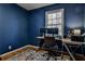 Home office with a large window, modern desk and chair, perfect for remote work at 571 Tahoe Cir, Stone Mountain, GA 30083