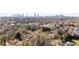 Stunning aerial view of a residential neighborhood with mature trees, and downtown in the horizon at 818 Springdale Ne Rd, Atlanta, GA 30306