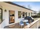 Back porch with outdoor seating, grill, and access to the home's interior at 818 Springdale Ne Rd, Atlanta, GA 30306