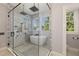 Beautiful bathroom with a modern soaking tub, glass shower, and hexagon tile flooring at 818 Springdale Ne Rd, Atlanta, GA 30306