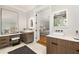 Modern bathroom with double vanity, stylish mirrors, and a view into the bedroom at 818 Springdale Ne Rd, Atlanta, GA 30306