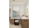 Bright bathroom featuring dual sinks, a large mirror, and a separate glass shower at 818 Springdale Ne Rd, Atlanta, GA 30306