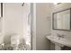 Bathroom with geometric floor tiles, pedestal sink, and shower with curtain at 818 Springdale Ne Rd, Atlanta, GA 30306