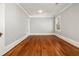 Empty bedroom with hardwood floors, neutral walls, and classic trim at 818 Springdale Ne Rd, Atlanta, GA 30306