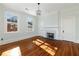 Cozy bedroom with hardwood floors, fireplace, and natural light at 818 Springdale Ne Rd, Atlanta, GA 30306