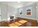 Bedroom featuring hardwood floors, fireplace, and windows with natural light at 818 Springdale Ne Rd, Atlanta, GA 30306