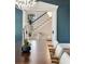 Stylish dining room with a white orchid and a chandelier that leads into the foyer at 818 Springdale Ne Rd, Atlanta, GA 30306