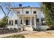 Charming two-story home with a columned front porch, black framed windows, and well-maintained landscaping at 818 Springdale Ne Rd, Atlanta, GA 30306
