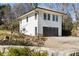 Exterior elevation of the property with garage and driveway. Side view at 818 Springdale Ne Rd, Atlanta, GA 30306