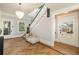 Bright foyer featuring herringbone floors, elegant light fixture, and staircase at 818 Springdale Ne Rd, Atlanta, GA 30306