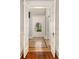 Elegant foyer with herringbone floors viewed from the hallway at 818 Springdale Ne Rd, Atlanta, GA 30306