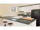 Kitchenette featuring dark countertops and stools, with natural light from window at 818 Springdale Ne Rd, Atlanta, GA 30306