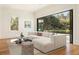 Modern living room with large sectional sofa, area rug, and views of the outdoors at 818 Springdale Ne Rd, Atlanta, GA 30306