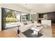Open living room with modern furnishings, hardwood floors, and access to the backyard at 818 Springdale Ne Rd, Atlanta, GA 30306