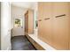 Convenient mudroom with built-in storage lockers, bench seating, and tile flooring at 818 Springdale Ne Rd, Atlanta, GA 30306