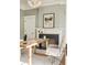 Light-filled office with a stylish wood desk, a cozy fireplace, and a view of the front yard at 818 Springdale Ne Rd, Atlanta, GA 30306