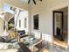 Charming covered patio featuring a modern seating arrangement, providing a relaxing outdoor space at 818 Springdale Ne Rd, Atlanta, GA 30306