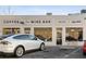 Exterior of coffee and wine bar with large windows, street parking, and a modern design at 818 Springdale Ne Rd, Atlanta, GA 30306