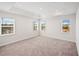 Spacious bedroom with recessed lights and three large windows at 1246 Allspice Way, Lawrenceville, GA 30045