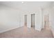 Spacious bedroom with neutral carpeting and entry to closet and bath at 1246 Allspice Way, Lawrenceville, GA 30045
