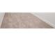 Close-up of newly installed neutral-toned carpet with white trim and baseboards at 1246 Allspice Way, Lawrenceville, GA 30045