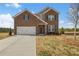 Charming brick two-story home with a well-maintained front yard and attached two-car garage at 1246 Allspice Way, Lawrenceville, GA 30045