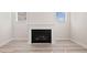 Modern fireplace with a white mantel, perfect for cozy evenings, with light wood-look floors at 1246 Allspice Way, Lawrenceville, GA 30045