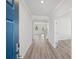 Inviting foyer with light wood-look floors, white walls, and a glimpse of the staircase at 1246 Allspice Way, Lawrenceville, GA 30045