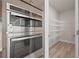 Stainless steel oven and microwave combo with a walk-in pantry at 1246 Allspice Way, Lawrenceville, GA 30045